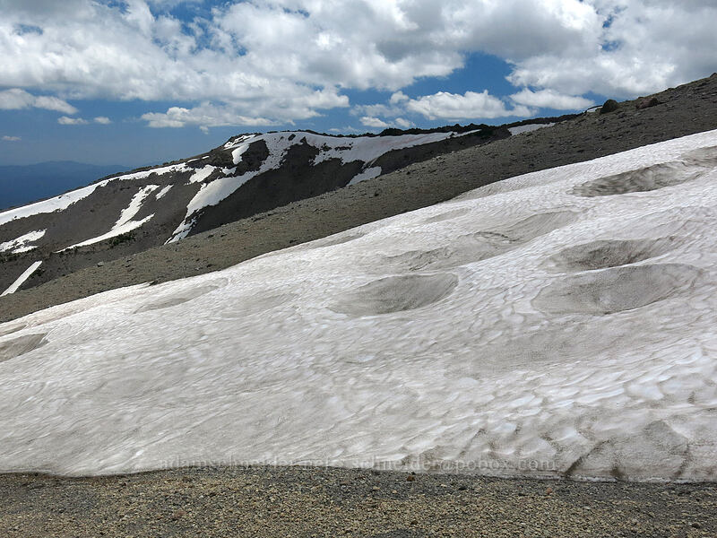 cratered snowfield [north of Mud Creek Canyon, Mount Shasta Wilderness, California]
