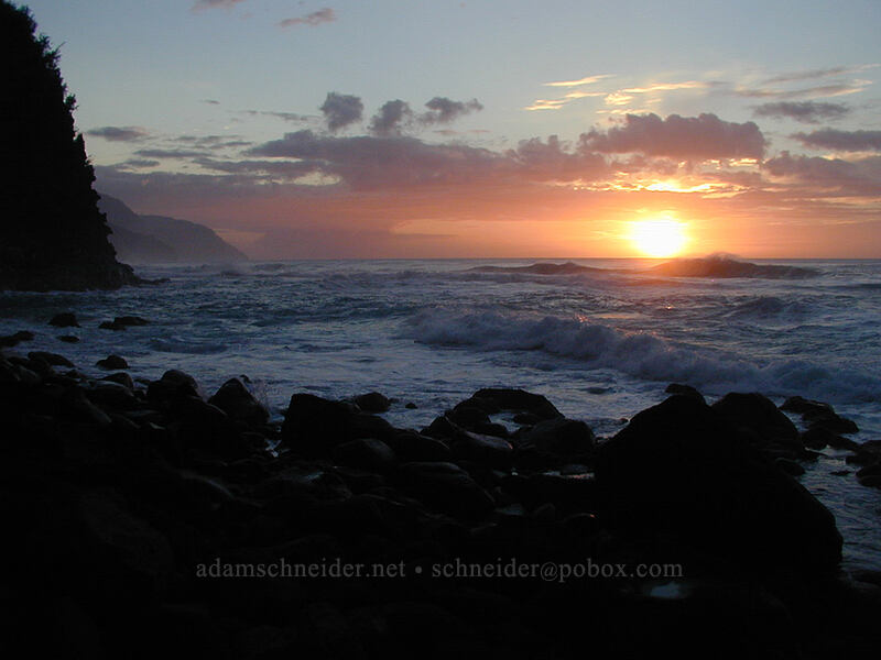 sunset with rocks, cliff, and surf [Ke'e Beach, Ha'ena State Park, Kaua'i, Hawaii]